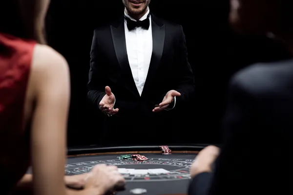A glamorous woman holding casino chips in a neon-lit environment, representing the premium online casino atmosphere of 86JLPH.