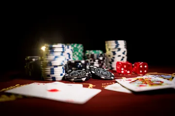 A man celebrating a winning moment on his laptop while gaming symbols float around him, capturing the excitement of 86JLPH games.