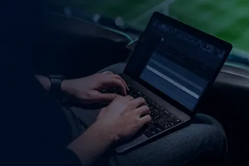 A laptop glowing with a bright login prompt in a minimalistic setup, symbolizing the protected access system at 86JLPH.